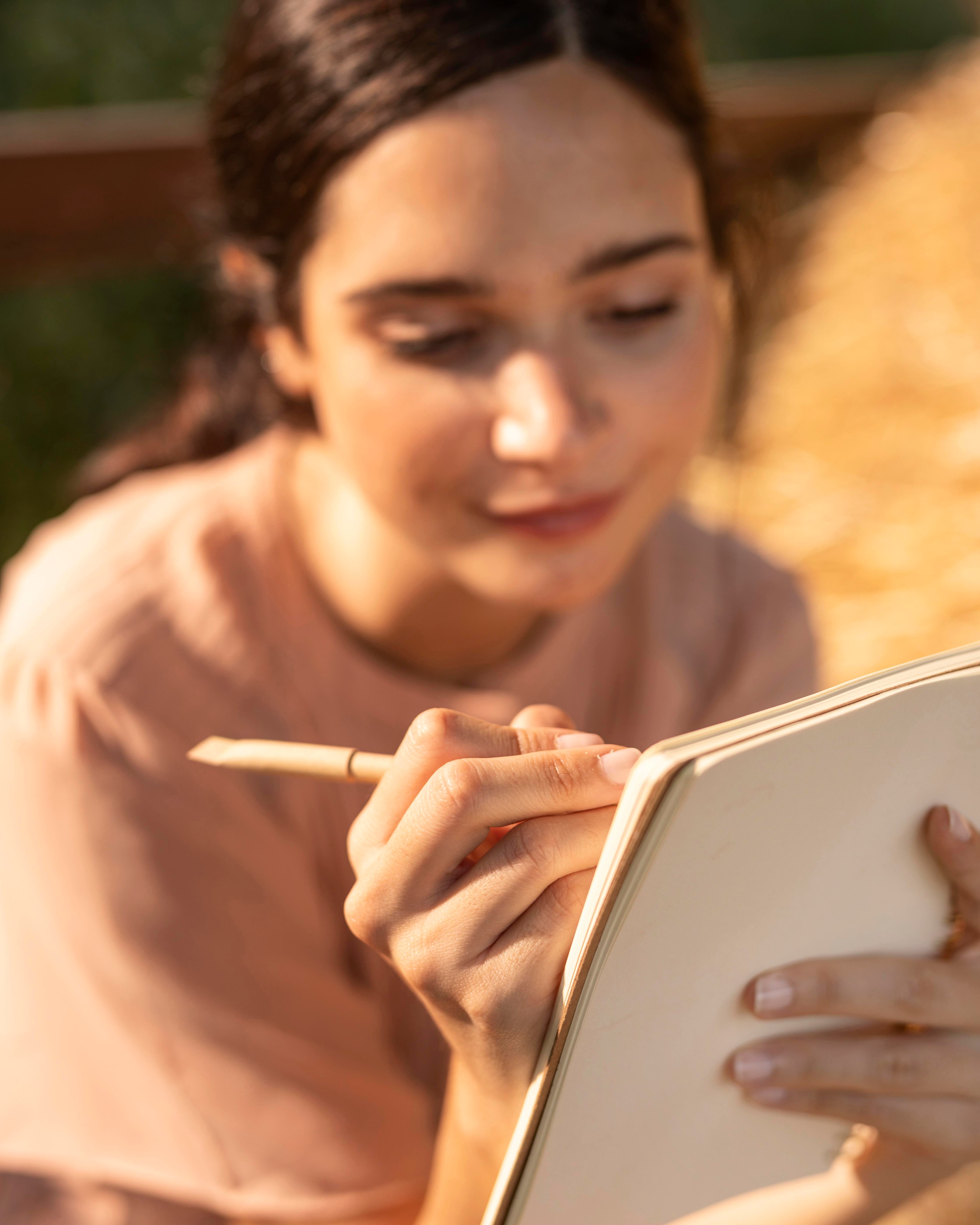 smiley-woman-writing-close-up.jpg